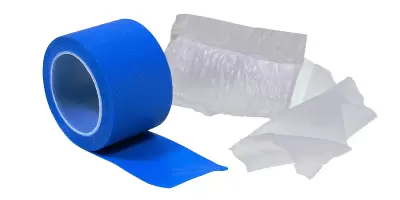 A roll of blue tape and a medium dressing